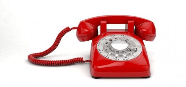 Plastic Red Emergency Phone on White Background